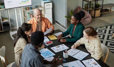 diverse-business-team-meeting-at-table