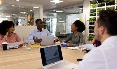 diverse-female-and-male-businesspeople-with-laptop