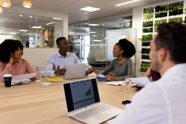 diverse-female-and-male-businesspeople-with-laptop