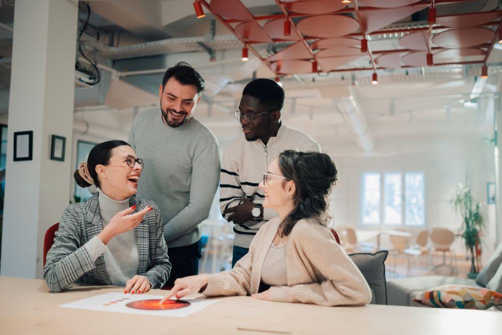 marketing-team-analyzing-charts-and-laughing