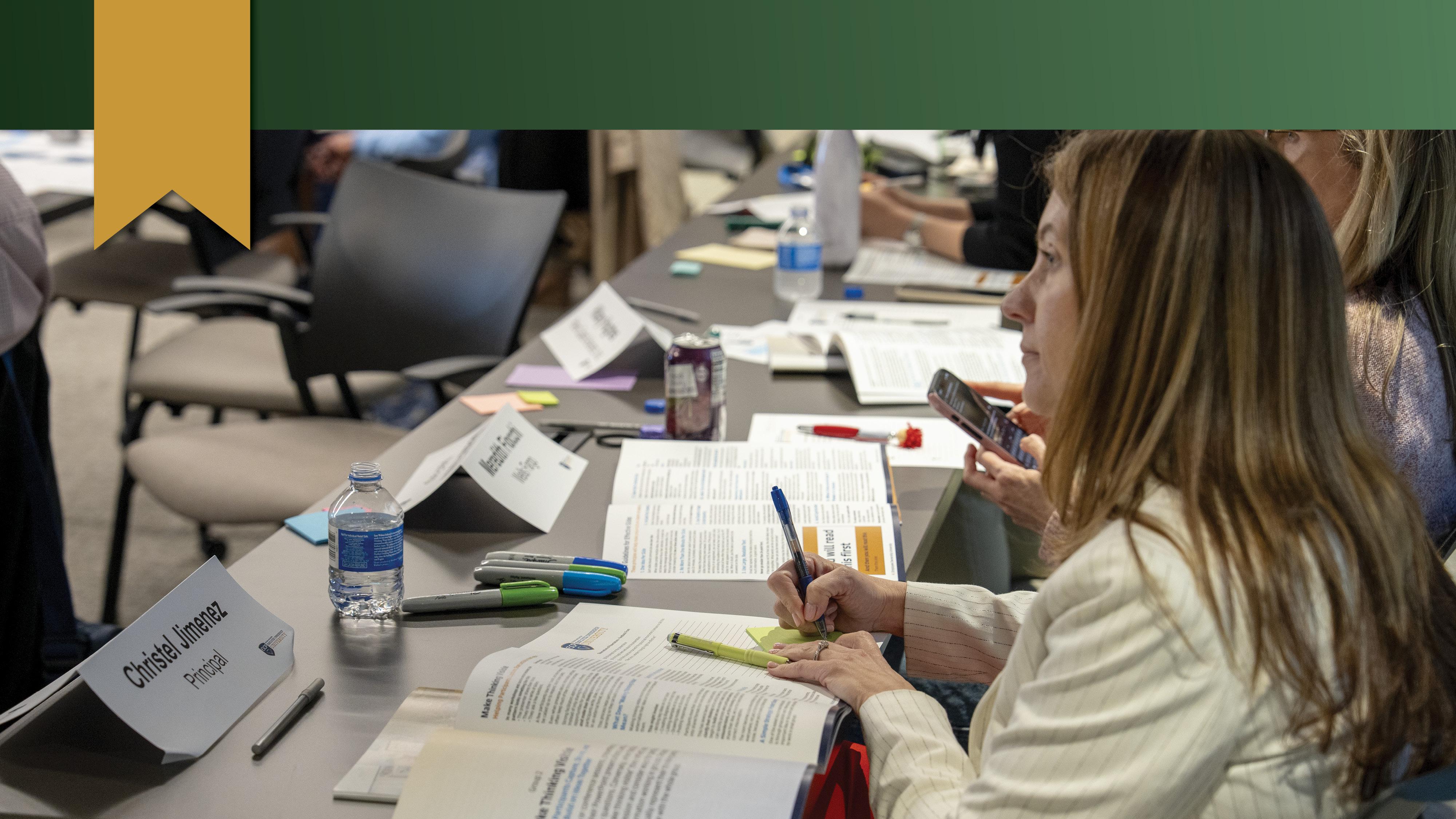 Attendee takes notes during the Facilitator Certification Program